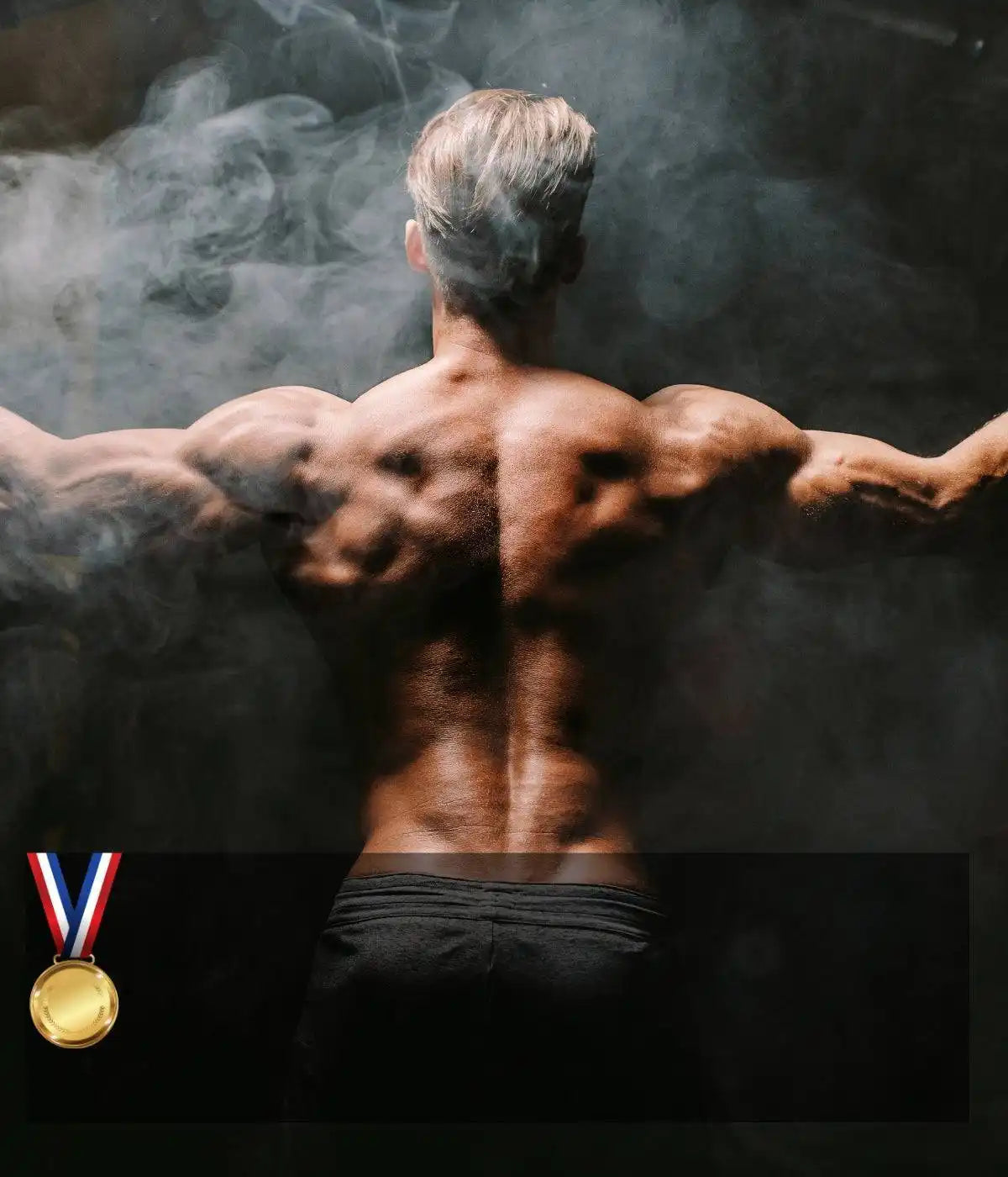 Muscular back of a shirtless athlete with arms outstretched amid smoke, with a gold medal visible in the corner.