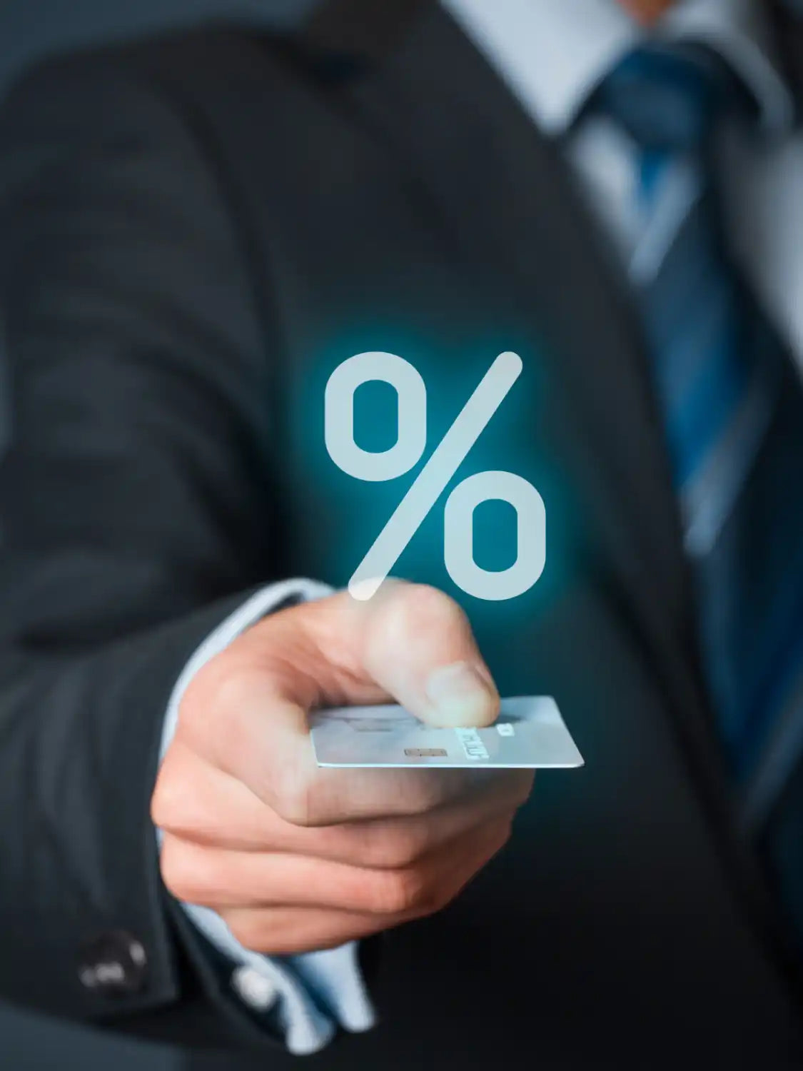 Glowing percentage symbol floating above a credit card.
