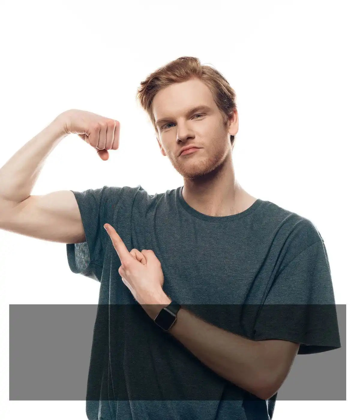 A person in a dark t-shirt flexing and pointing at their bicep muscle.