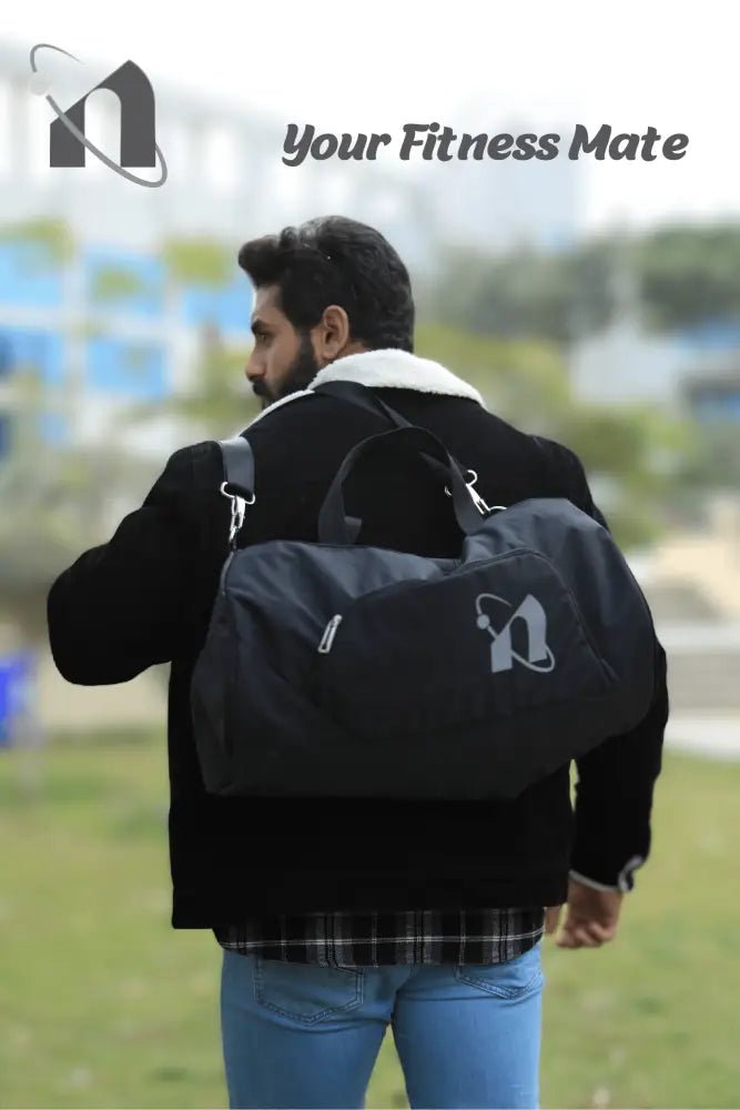 Black backpack with ’Your Fitness Mate’ logo worn by a person.