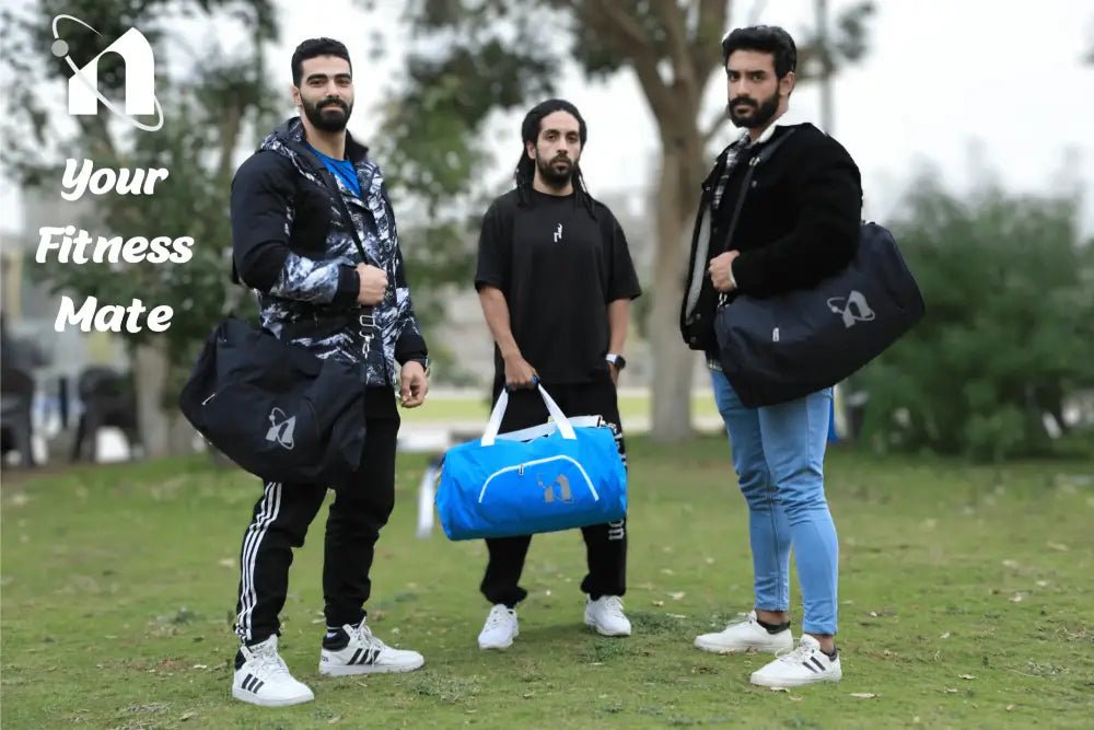 Three men standing together holding gym bags and fitness gear.